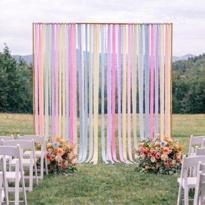 Arche rectangulaire or ruban tombant pastel mariage idf